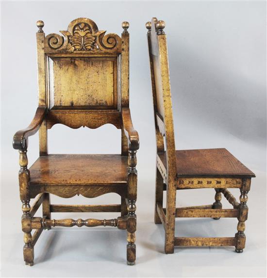 A set of eight 17th century style oak dining chairs, including two carvers, carvers W.1ft 10in. H.4ft
